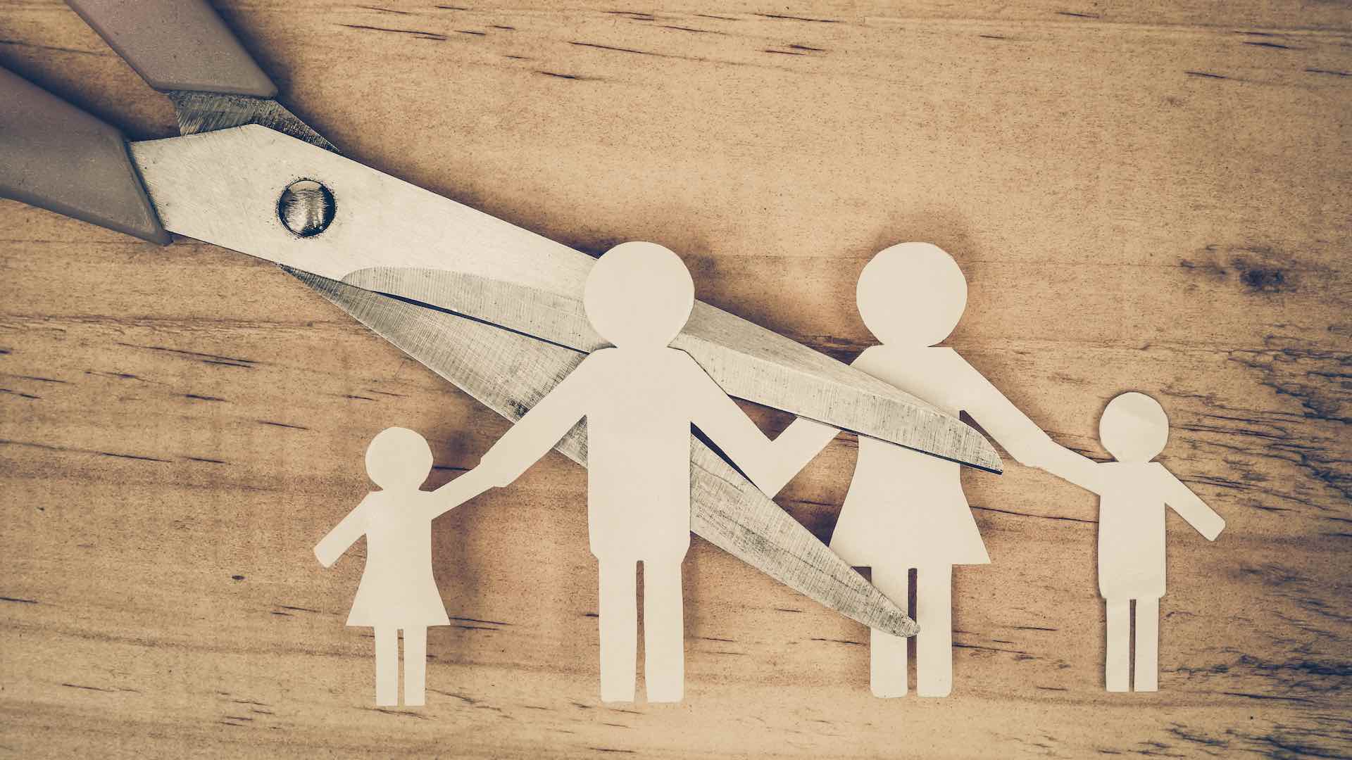 Scissors Cutting Paper Cut Of Family / Broken Family Concept / Divorce