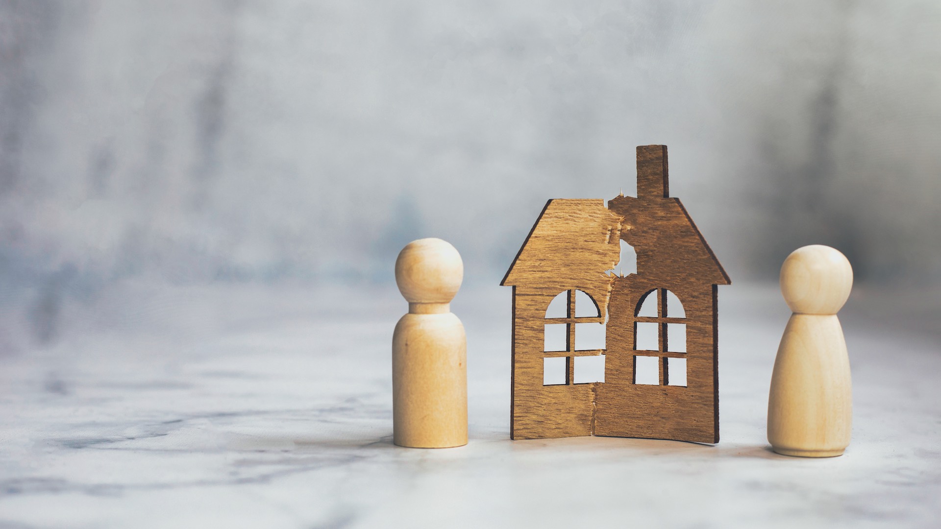 Divorce, Division Of Property, Poverty And No Money Concept. Wooden Broken House On Light Background. Mortgage, Rent, Realtor Concept Copy Space Space For Text